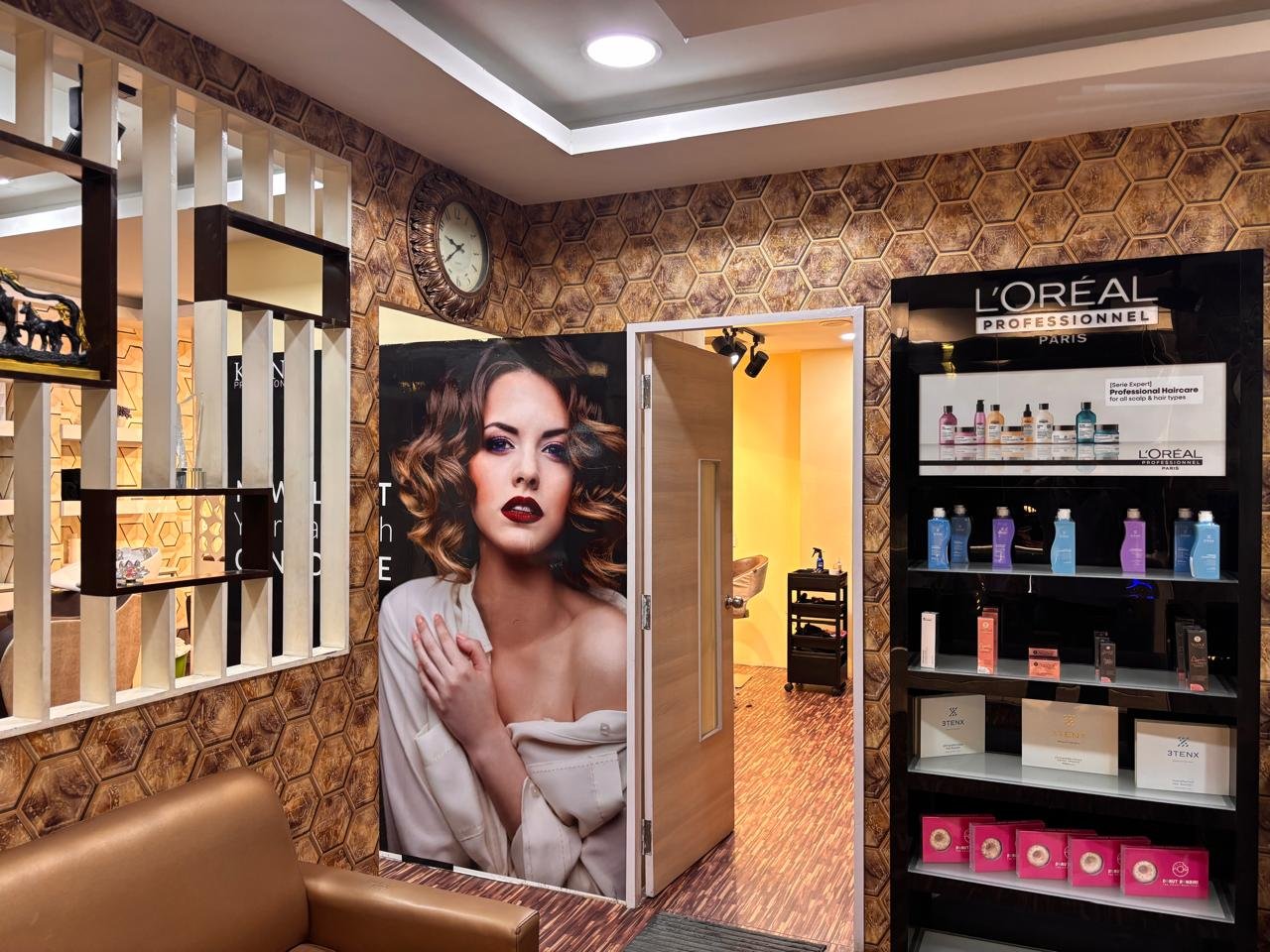 A product display and styling area inside GLAM salon